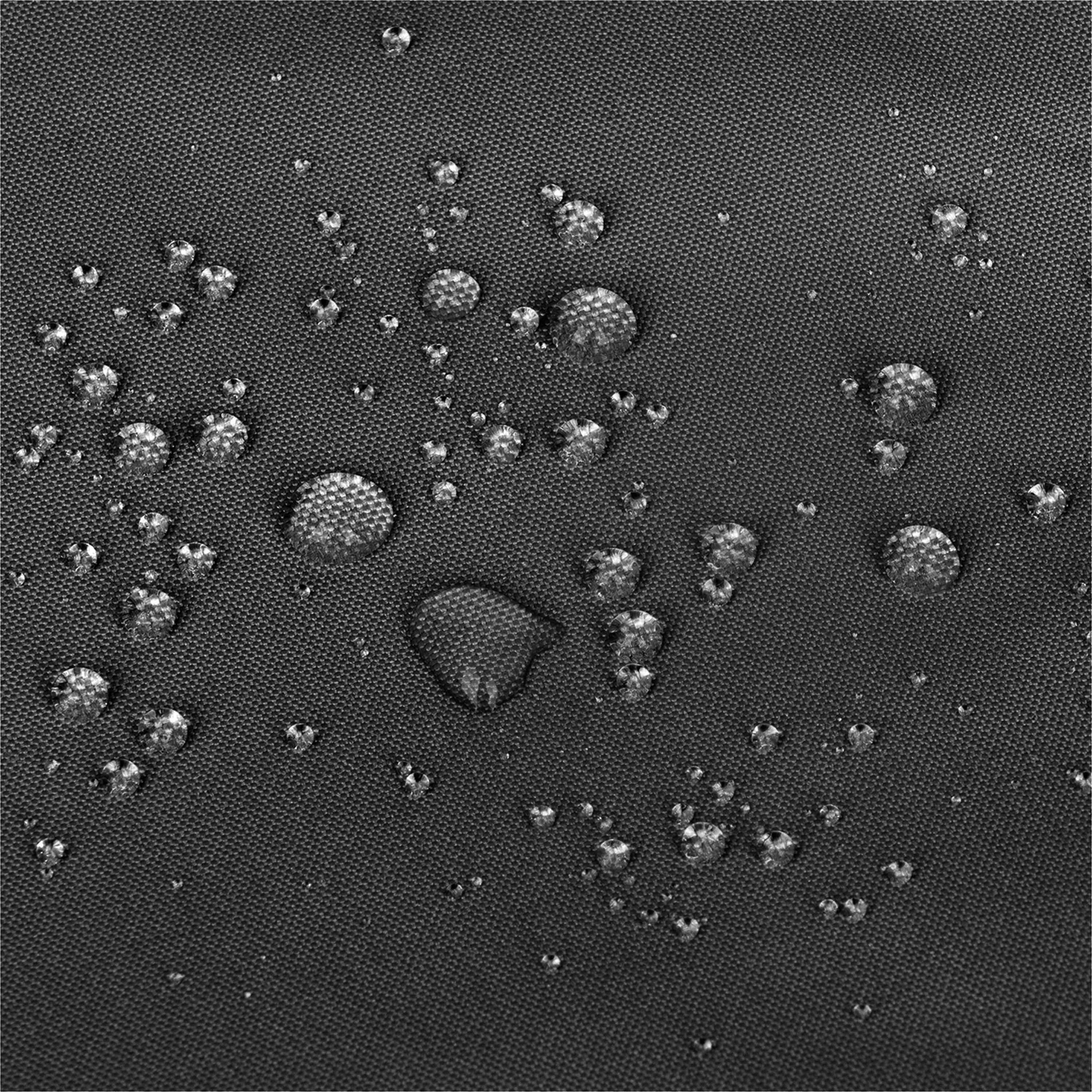 Close-up of a black textured fabric surface with multiple water droplets resting on top, showing a water-repellent or waterproof effect.