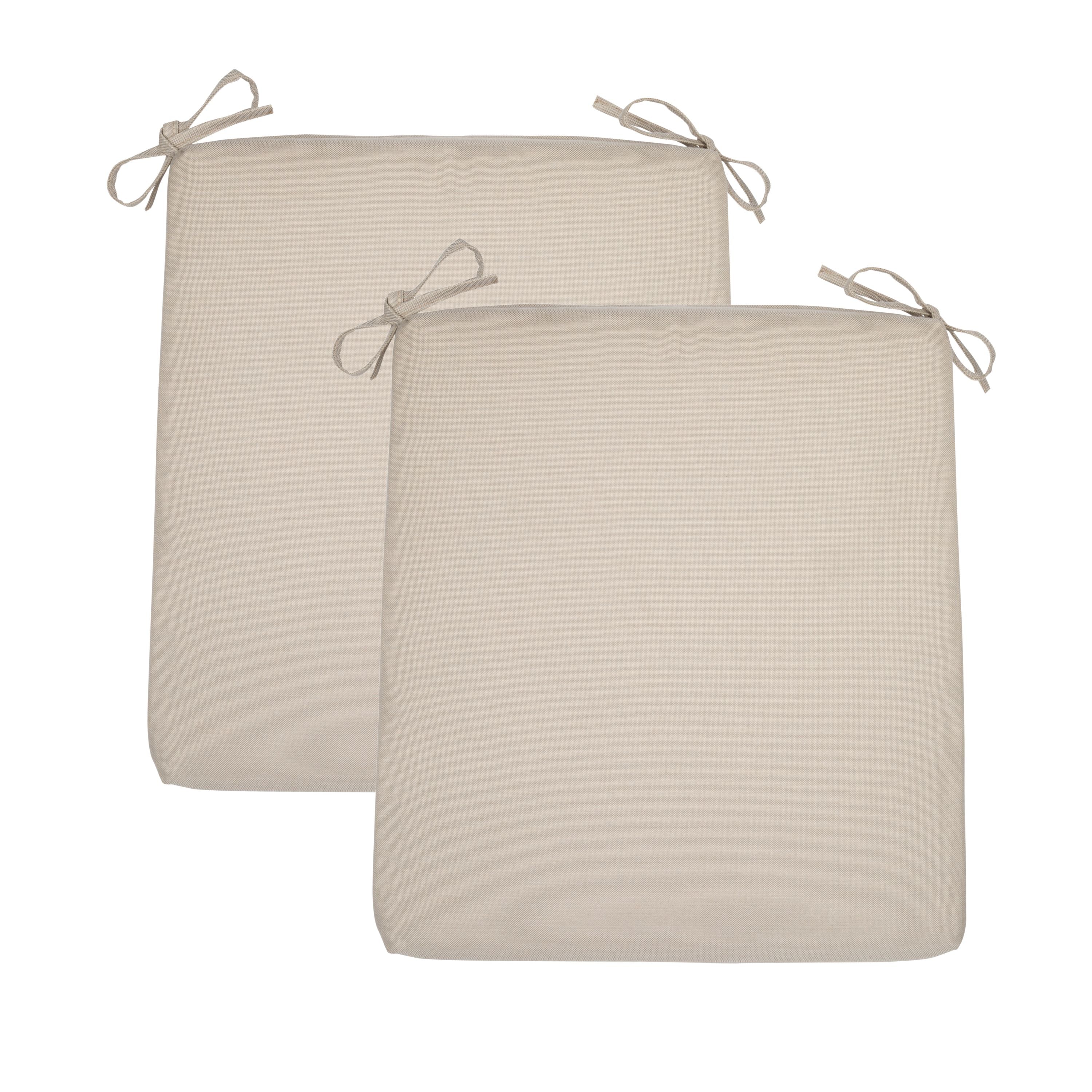 Two square khaki outdoor seat cushions with tie-on straps, shown overlapping on a plain white background.