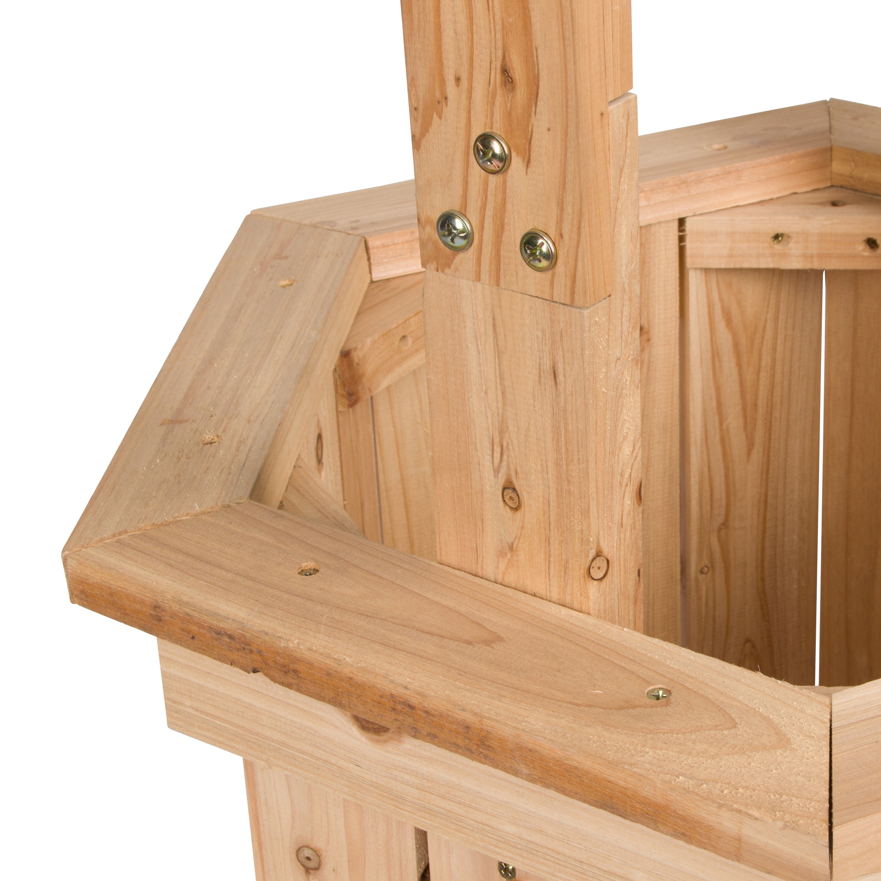 Close-up of a light natural wood structure, showing a house-shaped frame with a vertical post, horizontal beams, and metal fasteners on a white background.