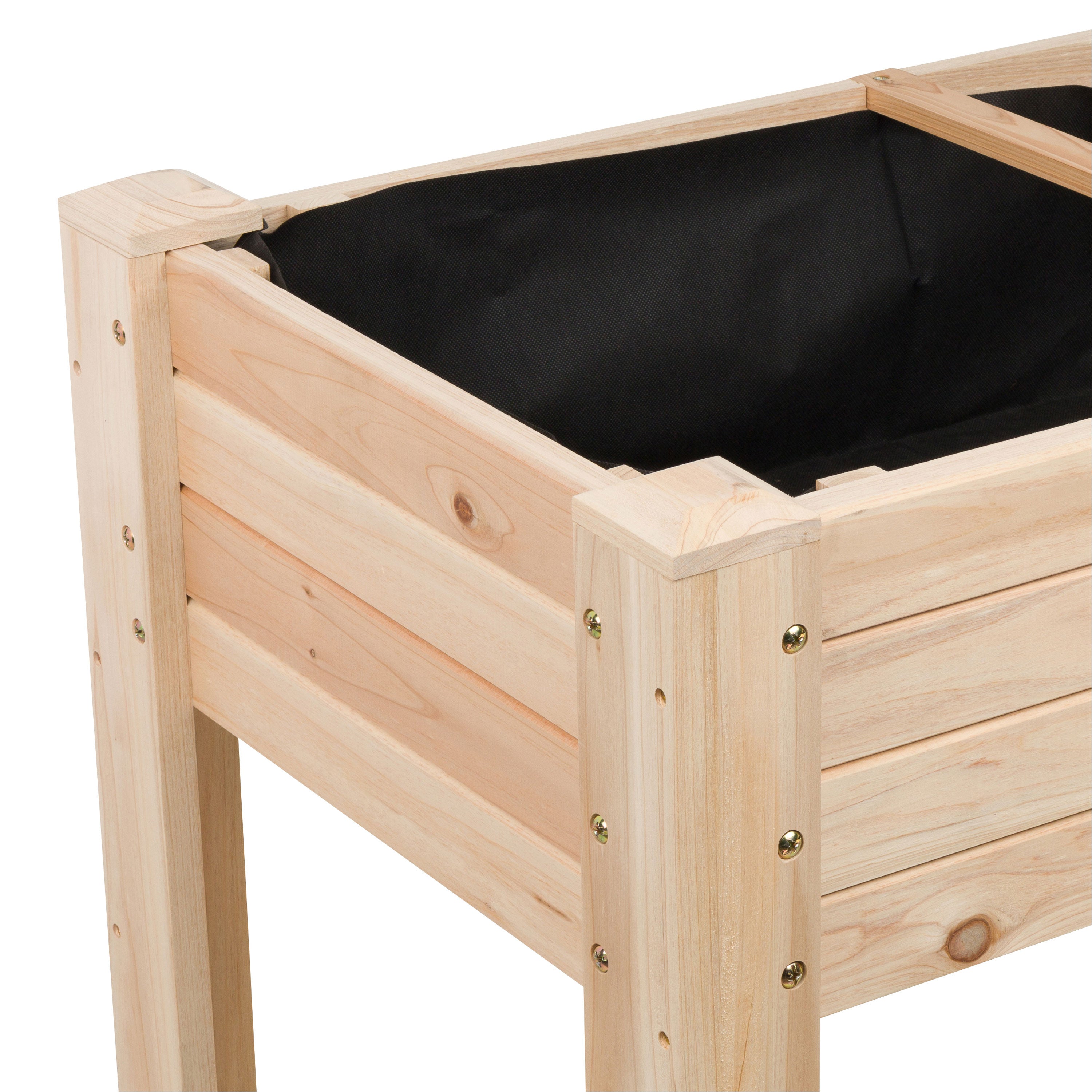 Close-up of a wooden raised garden bed with natural pine slats and a black fabric liner, shown on a white background.