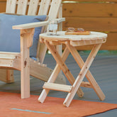 Wooden folding table on a deck with a glass of water and sunglasses. 