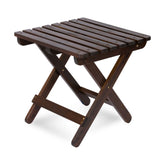 A dark brown folding wooden table with a slatted tabletop and crossed legs, shown on a clean white background. 