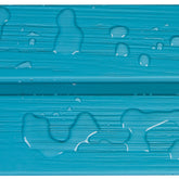 A close-up of a bright turquoise-blue textured surface with water droplets and puddles on a horizontal seam, showing a waterproof or water-resistant finish. 