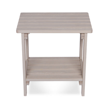 A square outdoor side table with a slatted top and lower shelf, finished in a light taupe-gray color, shown against a plain white background. 