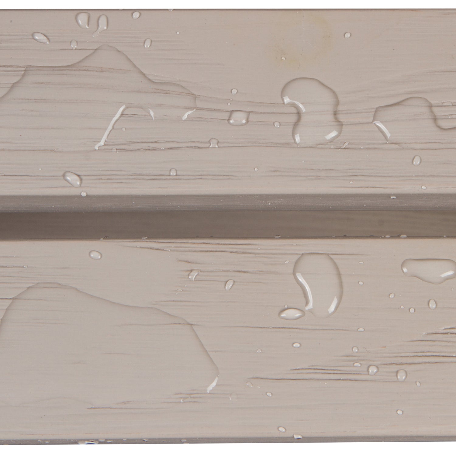 Close-up of a beige wood-textured surface with water droplets and a horizontal seam. 