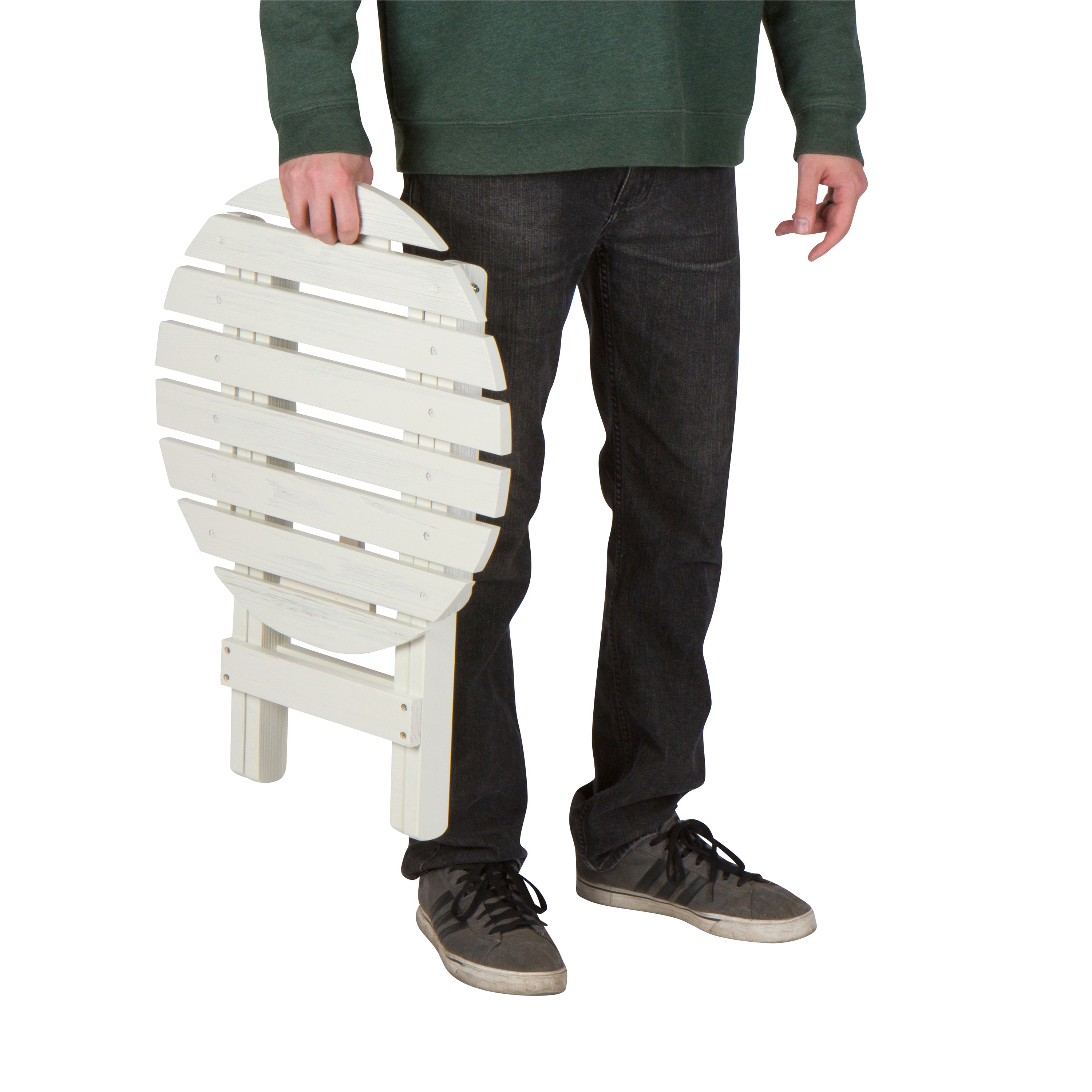 A person holding a folded white slatted chair against a plain white background. 