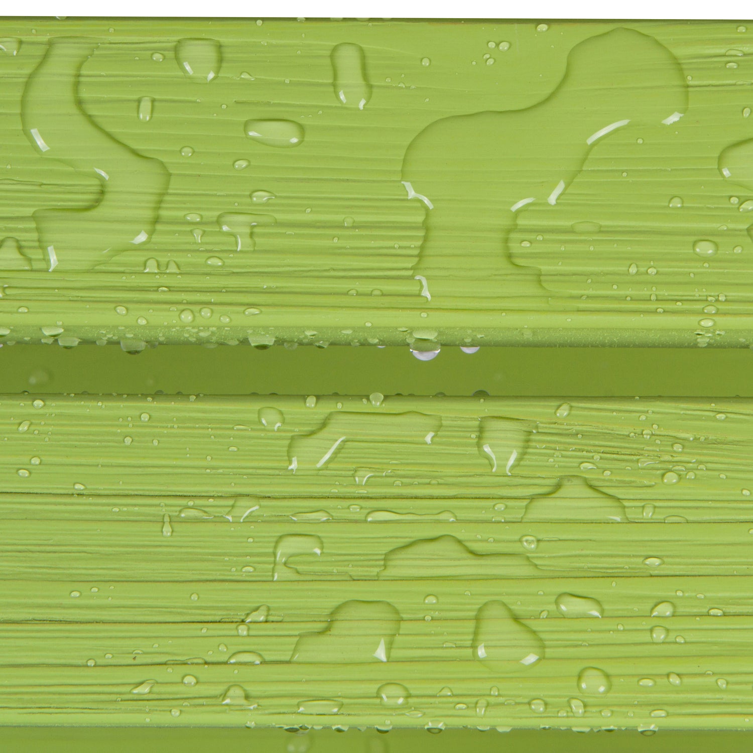 Close-up of a glossy light green textured surface with water droplets and horizontal ridges. 