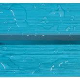 A close-up of a bright turquoise textured surface with horizontal ridges and scattered water droplets. 