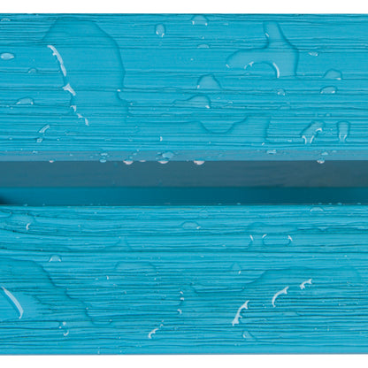 A close-up of a bright turquoise textured surface with horizontal ridges and scattered water droplets. 