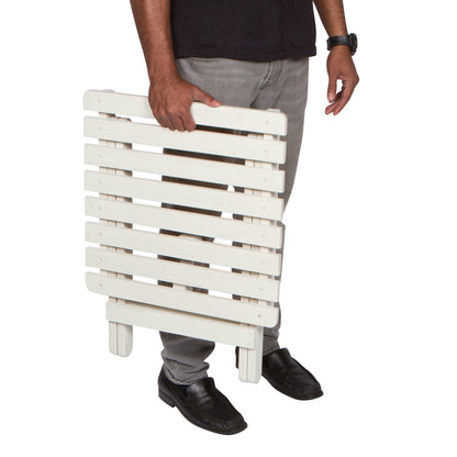 Person holding a white folding table on a white background 