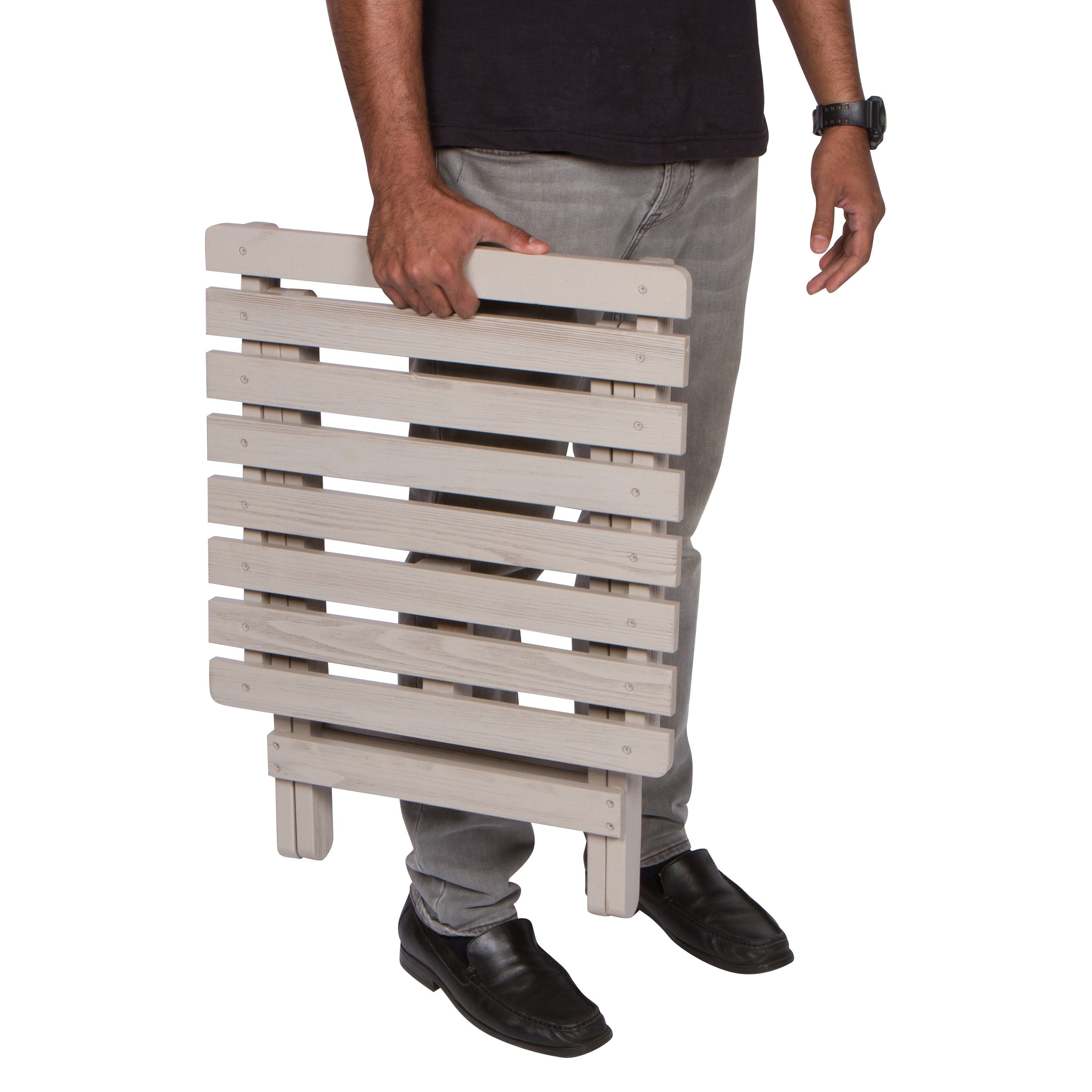 Person holding a wooden folding table on a white background 