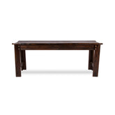A dark brown wooden dining bench with a rustic plank top and four sturdy legs, shown against a plain white background. 