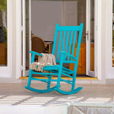 Turquoise rocking chair on a patio with sliding glass doors in the background 