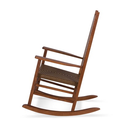 A classic wooden rocking chair with a warm brown finish and a woven brown and beige seat, shown from a three-quarters angle on a white background. 