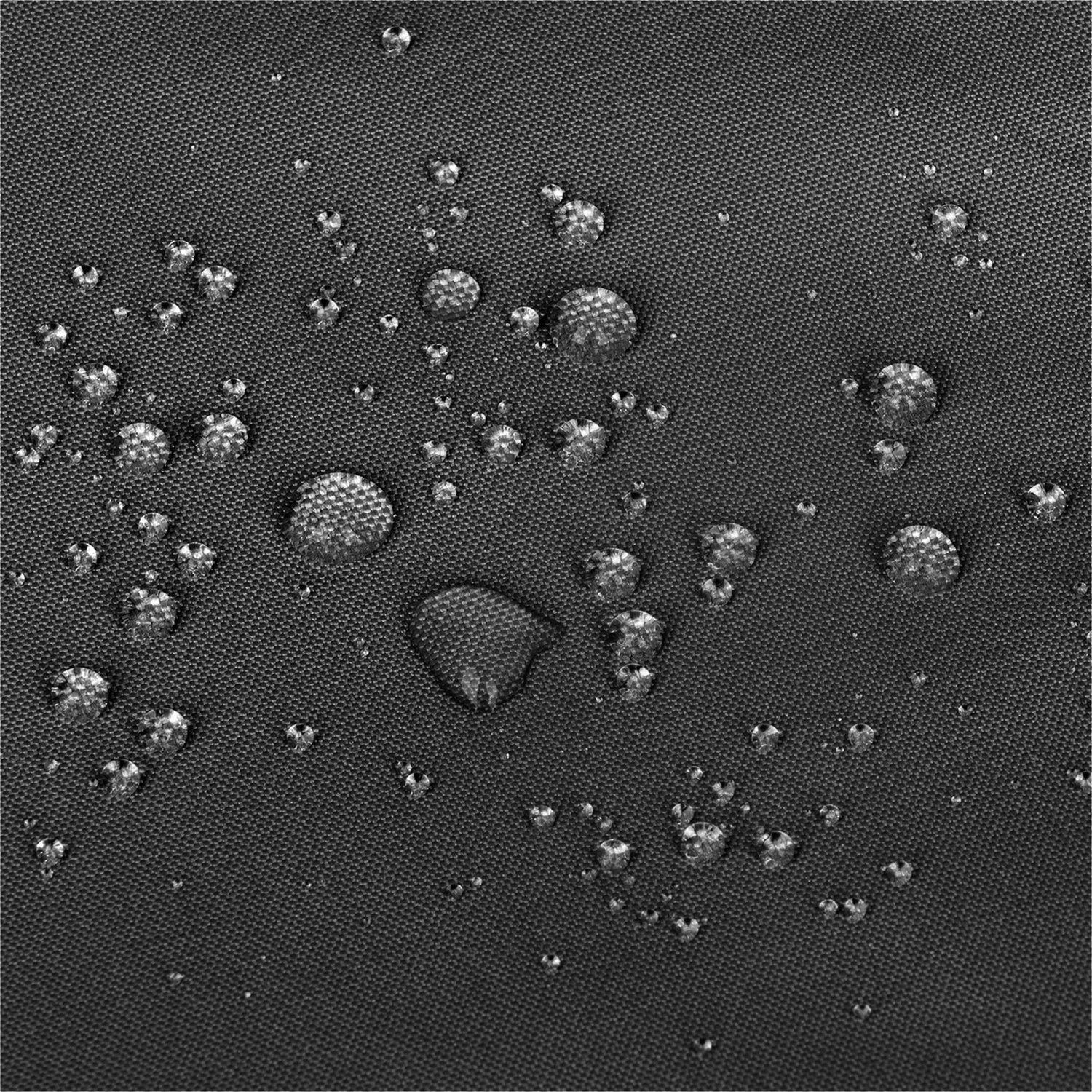 Close-up of a dark gray textured fabric surface with multiple water droplets resting on top, showing a water-repellent or waterproof effect. 