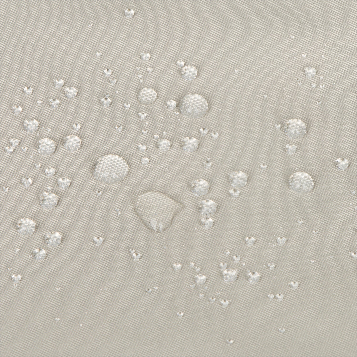 Close-up of a light gray fabric surface with scattered clear water droplets showing a repellent, water-repellant finish. 
