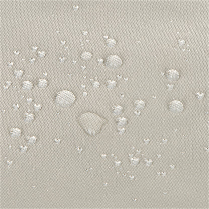 Close-up of a light gray fabric surface with scattered clear water droplets showing a repellent, water-repellant finish. 