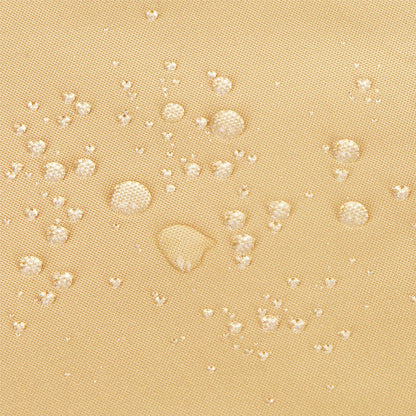 Close-up of a beige textured fabric surface with scattered clear water droplets showing a water-repellent finish. 