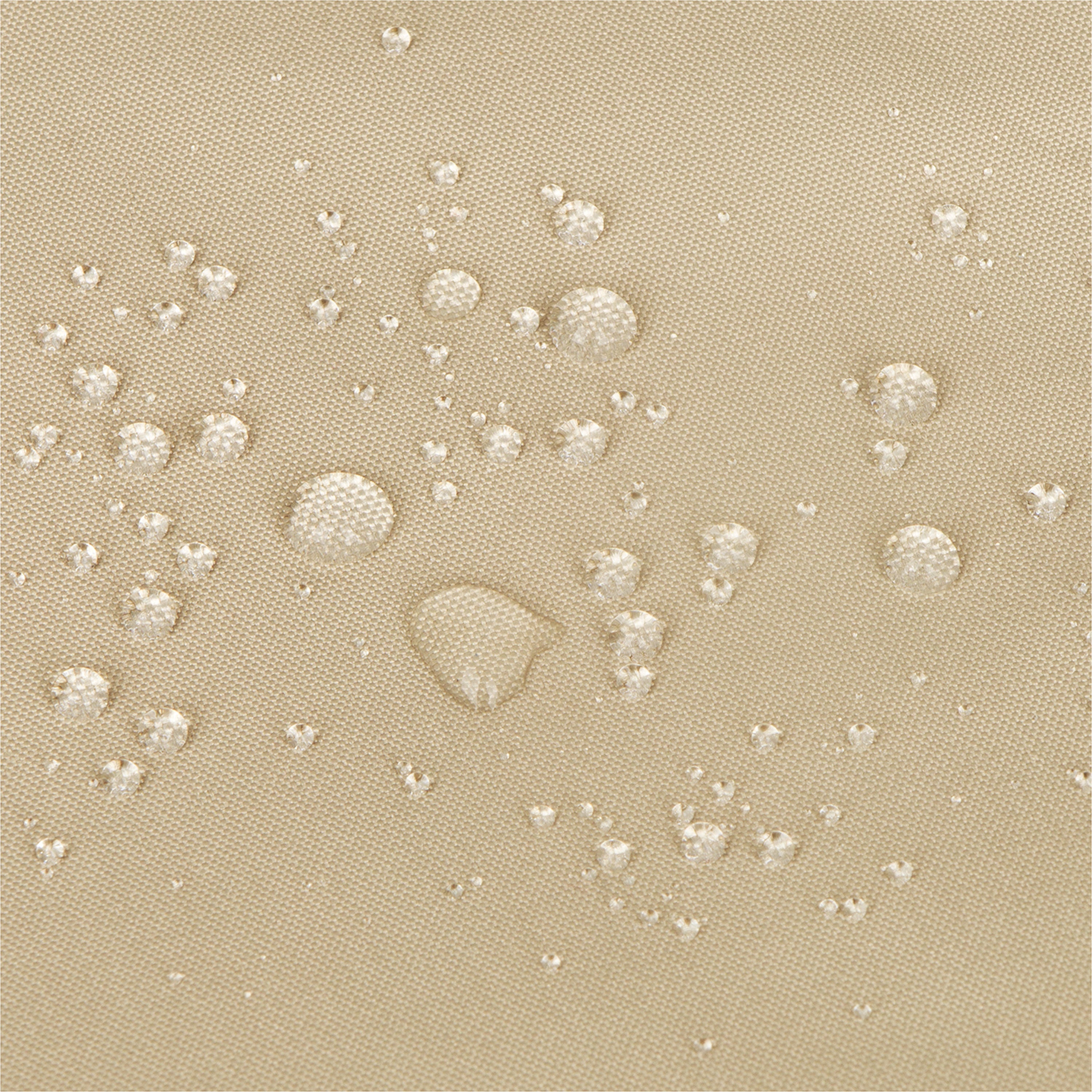 Close-up of a khaki textured fabric surface with clear water droplets beaded on top, demonstrating a water-repellent or waterproof finish. 