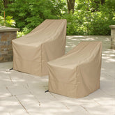 Two khaki outdoor chair covers on patio chairs in a garden patio setting. 