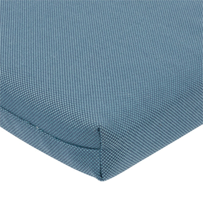 Close-up of a textured blue woven fabric cushion corner with a visible seam on a white background. 