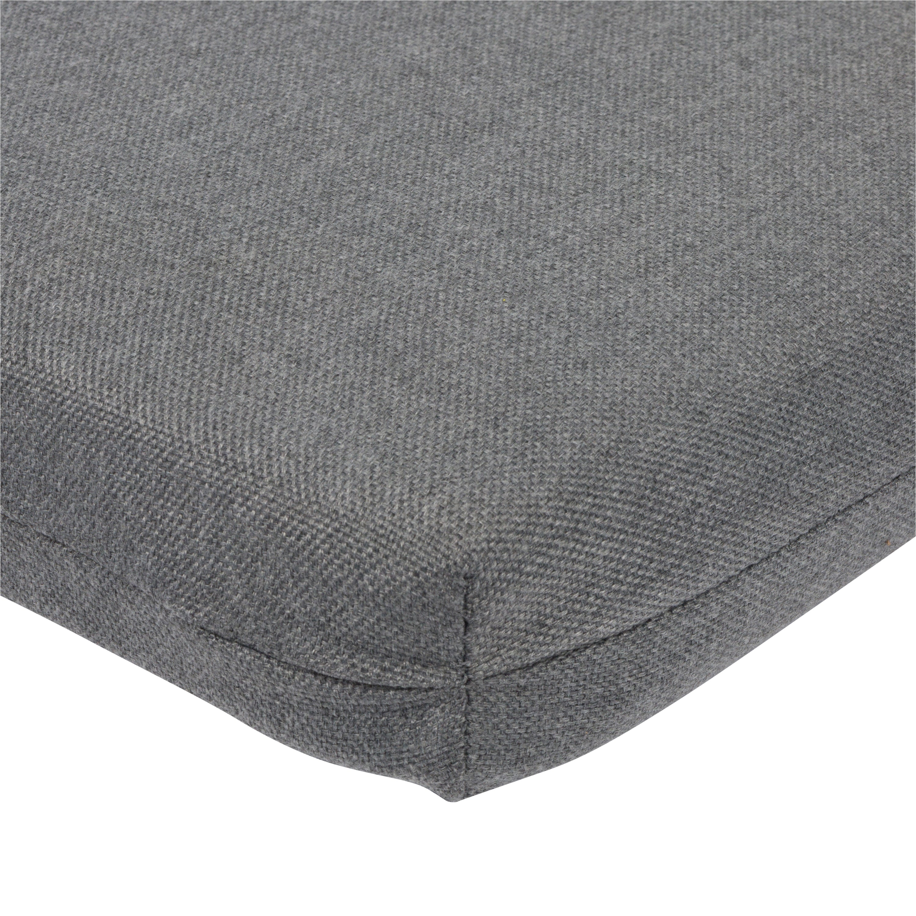 Close-up of a gray woven fabric cushion corner with visible stitching and a clean white background. 
