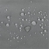 A close-up of a gray textured surface with scattered small raised circular bumps and a few larger bumps, resembling a fabric or material swatch rather than a finished consumer product. 