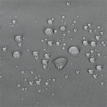 A close-up of a gray textured surface with scattered small raised circular bumps and a few larger bumps, resembling a fabric or material swatch rather than a finished consumer product. 