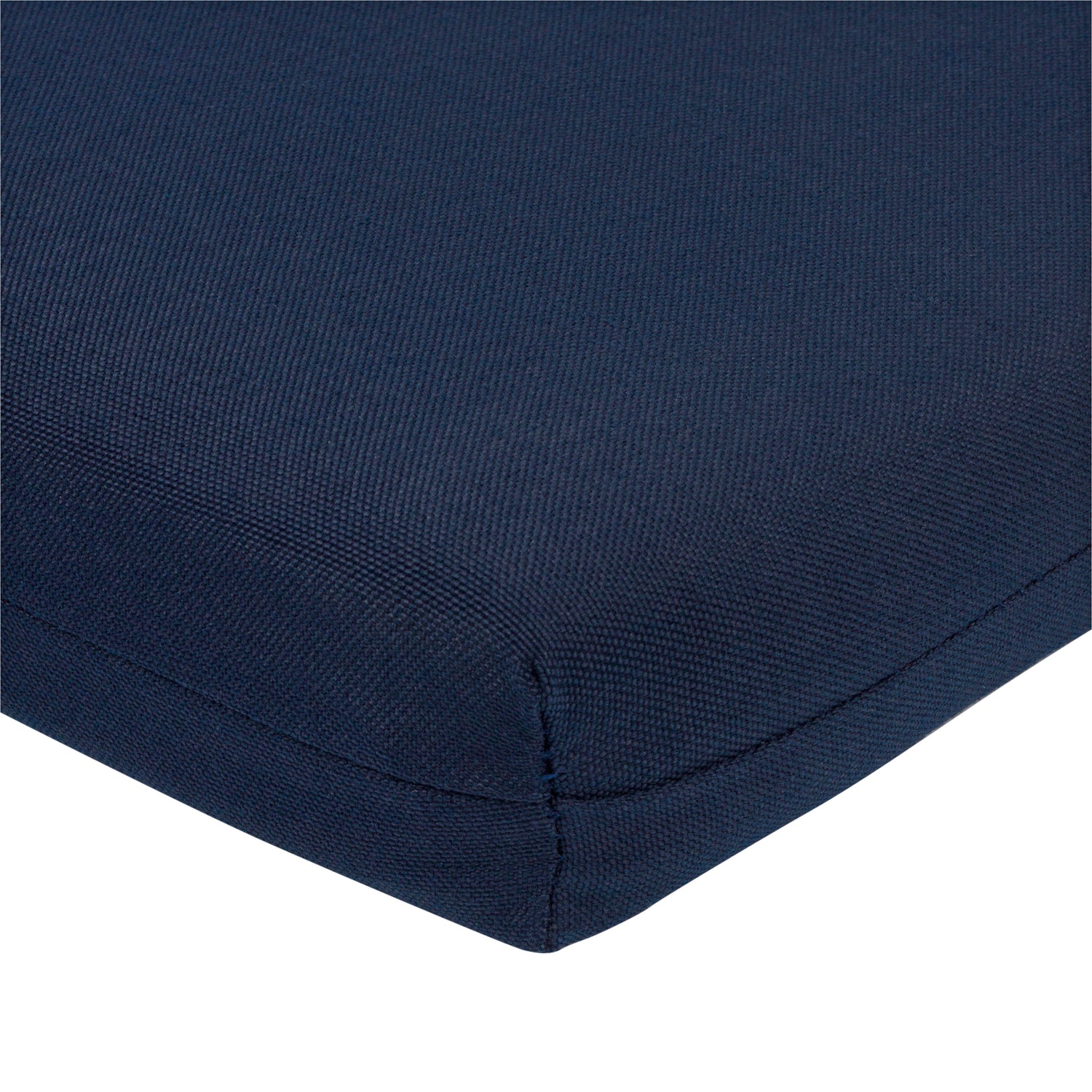 Close-up of a navy blue textured fabric cushion corner with a clean white background. 