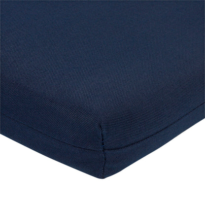 Close-up of a navy blue textured fabric cushion corner with a clean white background. 