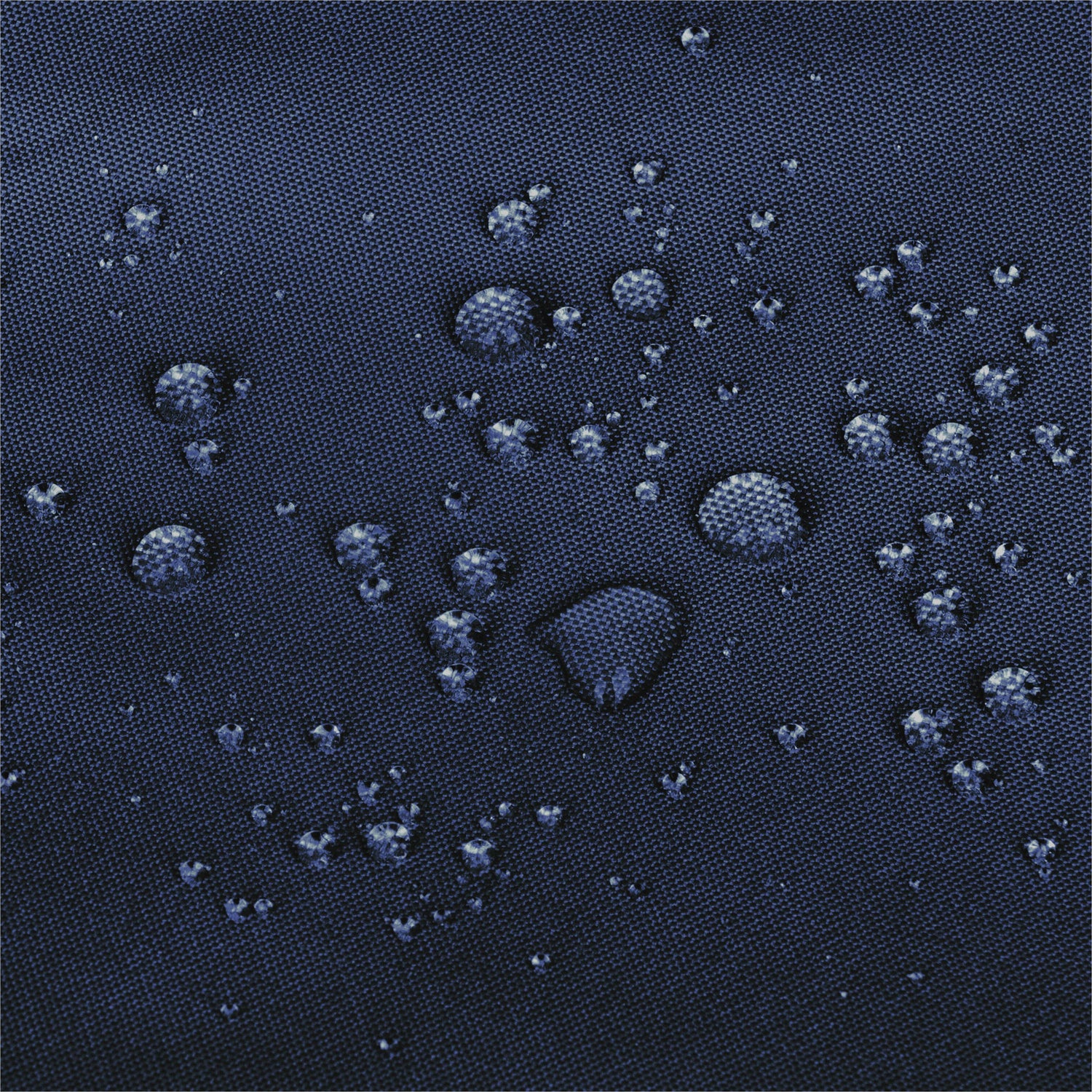 Close-up of a dark navy blue textured fabric surface with multiple water droplets resting on it. 