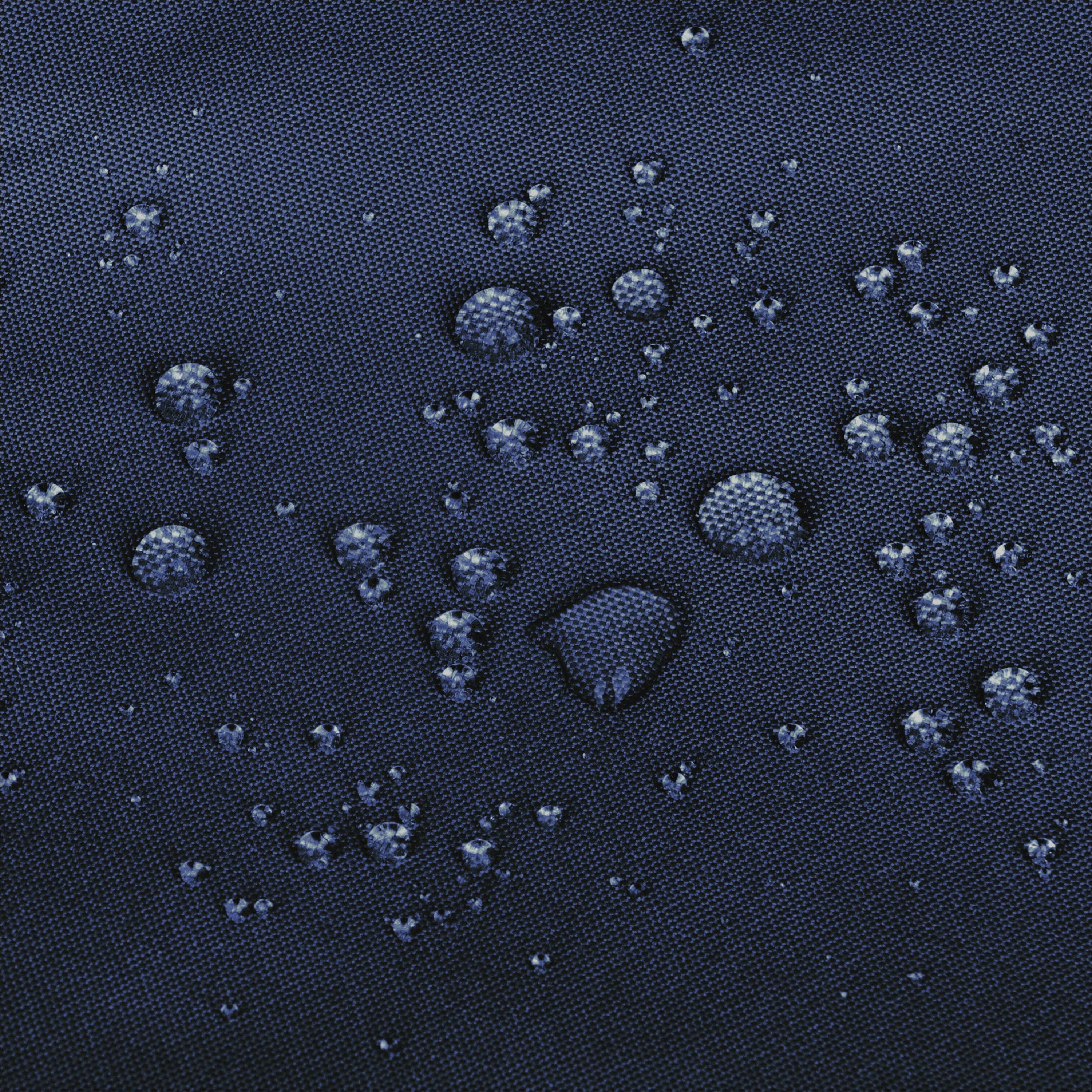 Close-up of a dark navy blue textured fabric surface with multiple water droplets resting on it. 
