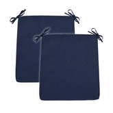Two navy blue rectangular outdoor seat cushions with black tie-down straps, shown overlapping on a plain white background. 