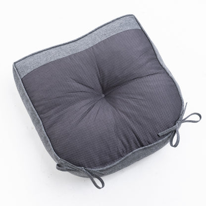 A square gray cushion with a textured mesh center and a solid heather gray fabric border, featuring tie-on corner straps, shown on a plain white background. 