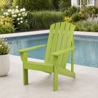 A lime green outdoor Adirondack chair positioned on a light stone patio next to a swimming pool, with a landscaped garden background. 