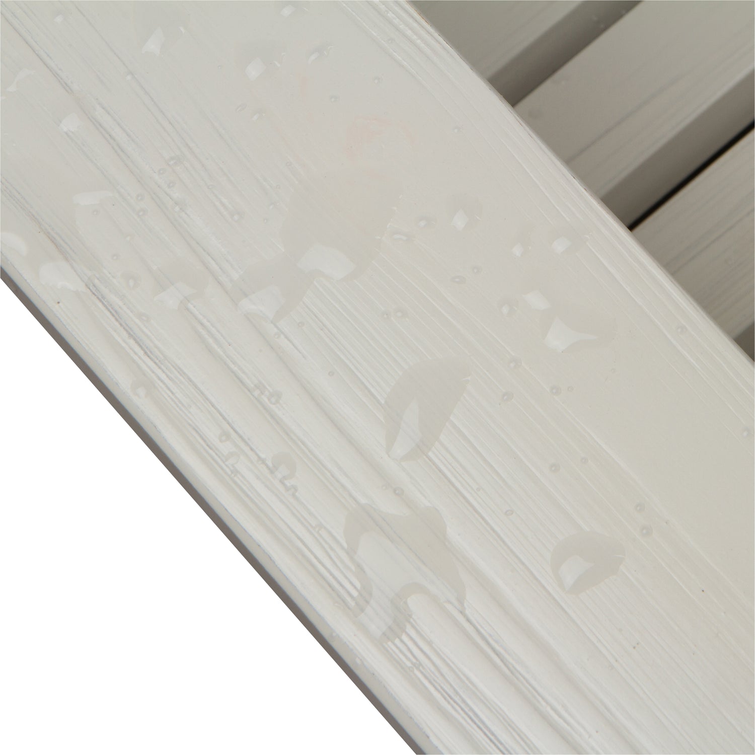 Close-up of a eggshell white armrest showcasing the glossy, water resistant finish for Adirondack chair. 