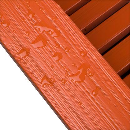 Close-up of an orange textured slatted surface with water droplets beading on top, showing a glossy, ribbed finish. 