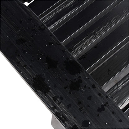 Close-up of a glossy black textured wooden slat surface showing the water resistant paint quality against a white background with diagonal black bars. 