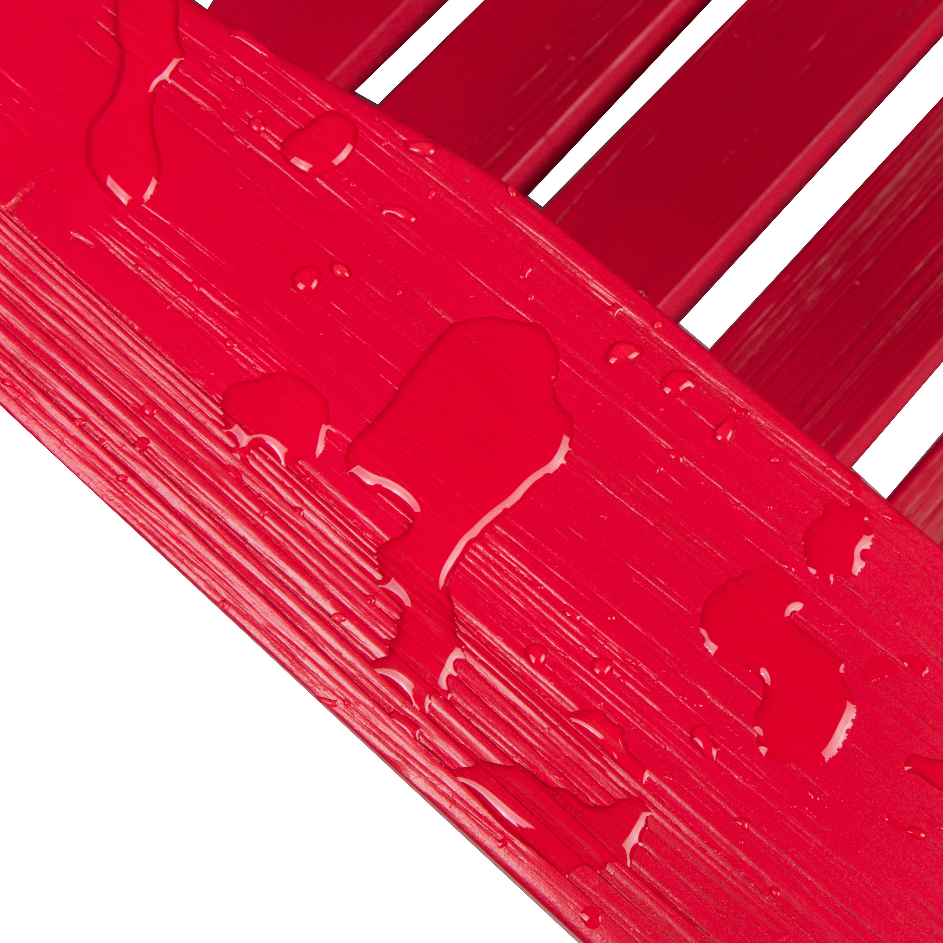 A close-up of a glossy red painted wooden slat surface with water droplets running down the textured finish, set against a white background. 