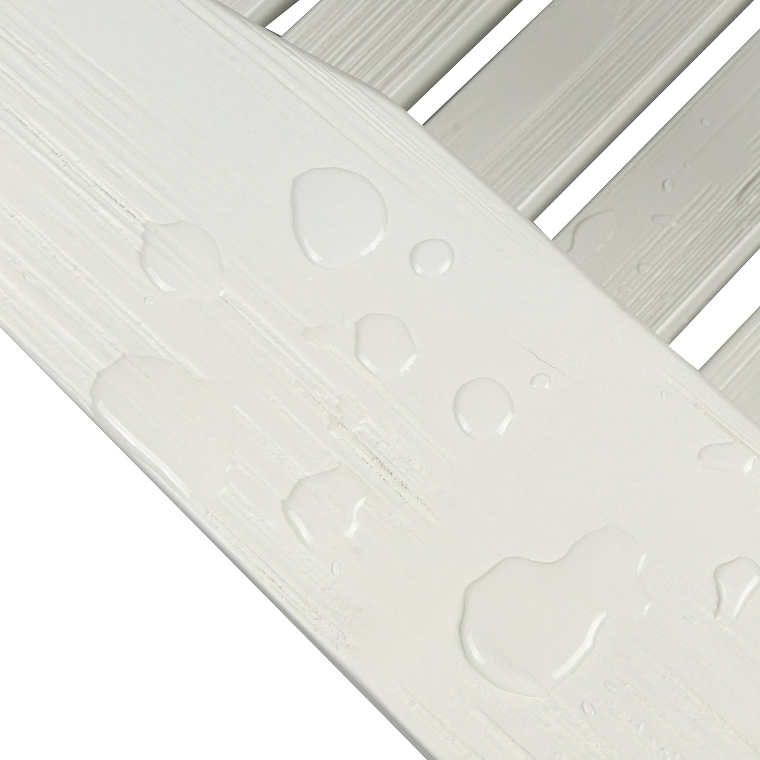 Close-up of a white slatted surface with water droplets beaded up on the slats, showing a clean, waterproof finish against a white background. 