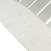 Close-up of a white slatted surface with water droplets beaded up on the slats, showing a clean, waterproof finish against a white background. 