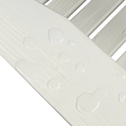 Close-up of a white slatted surface with water droplets beaded up on the slats, showing a clean, waterproof finish against a white background. 
