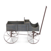 A rustic decorative wagon or cart with a weathered gray wooden body and dark brown metal frame, wheels, and handle, shown on a plain white background.  