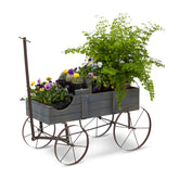 A rustic gray wooden planter wagon filled with green plants and colorful flowers, shown on a clean white background. 