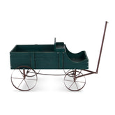 A dark green wooden garden cart with a long brown metal handle and four spoked wheels, shown from a side profile on a white background.  