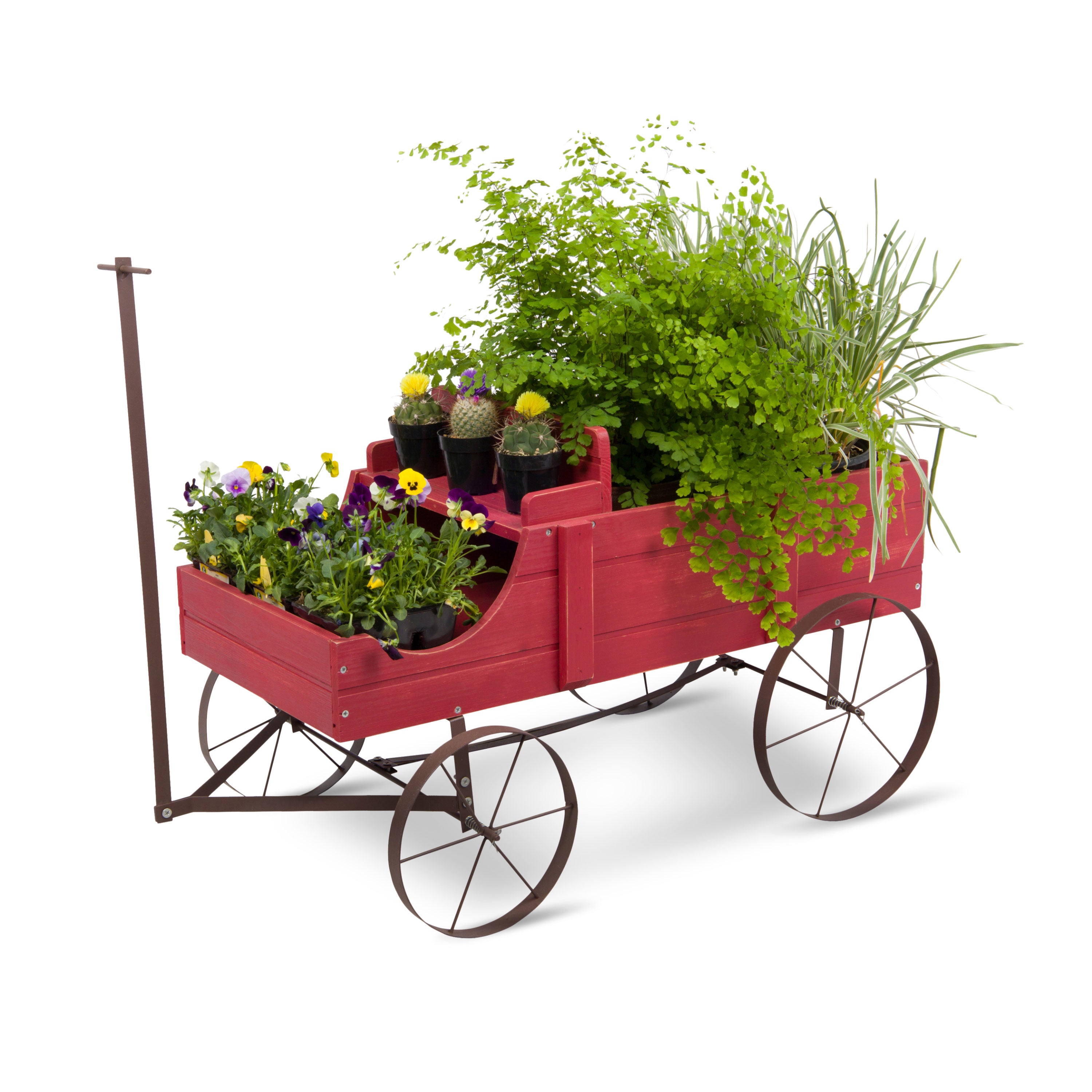 A red wooden garden wagon planter with a dark metal frame and wheels, filled with green plants and small potted flowers, shown on a white background. 