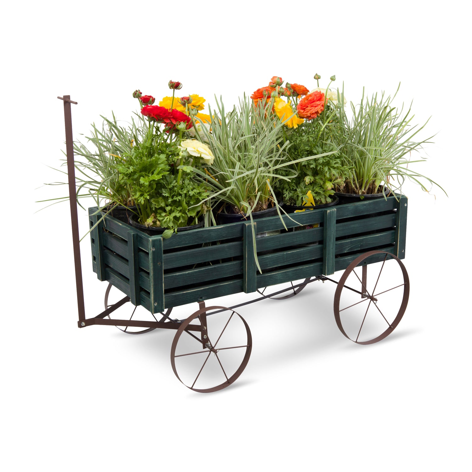 A dark green wooden slat planter wagon with metal wheels and a handle, filled with green ornamental grasses and colorful flowers, photographed on a white background. 