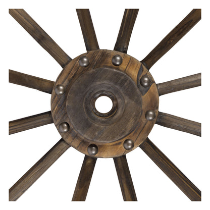 A rustic wooden wagon wheel wall decor piece with dark brown spokes and a central round hub accented by small metallic studs, shown against a plain white background. 