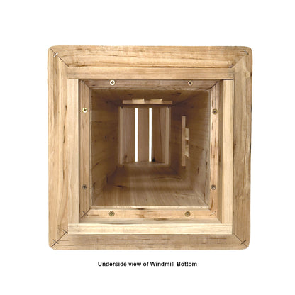 An underside view of a wooden windmill bottom structure, showing the interior frame and slats, with a caption underneath reading &