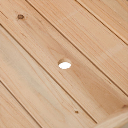 Close-up of a light natural wood slatted surface with visible wood grain, knots, and a circular cutout in the center. 